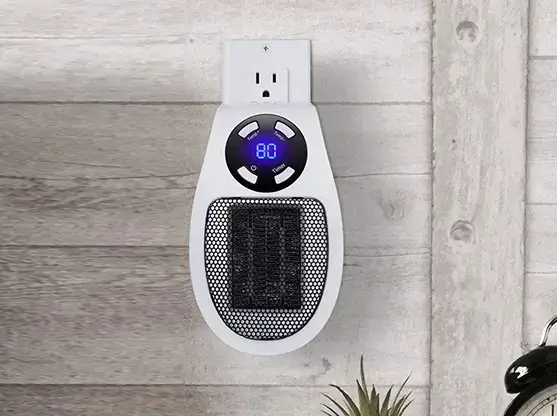 Toasty Heater plugged into a wall outlet showing an 80°F digital display